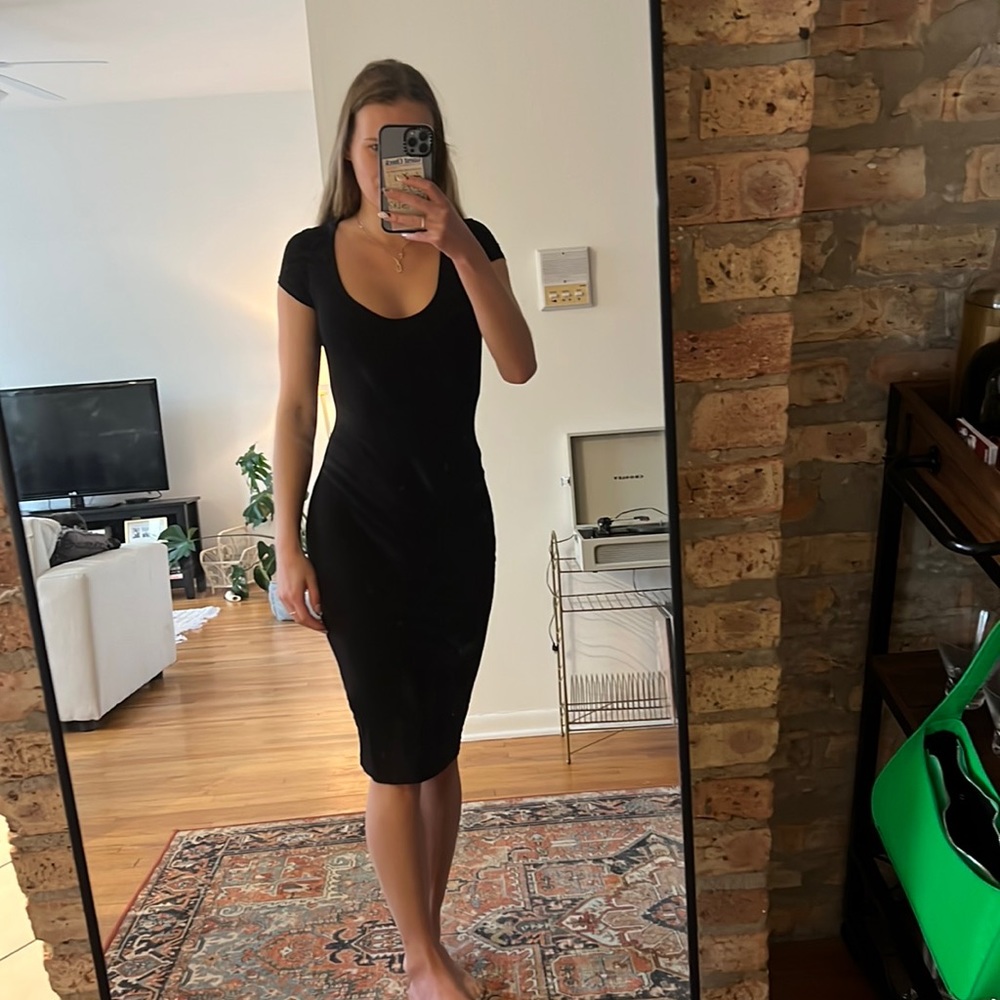 Tight black mid length dress